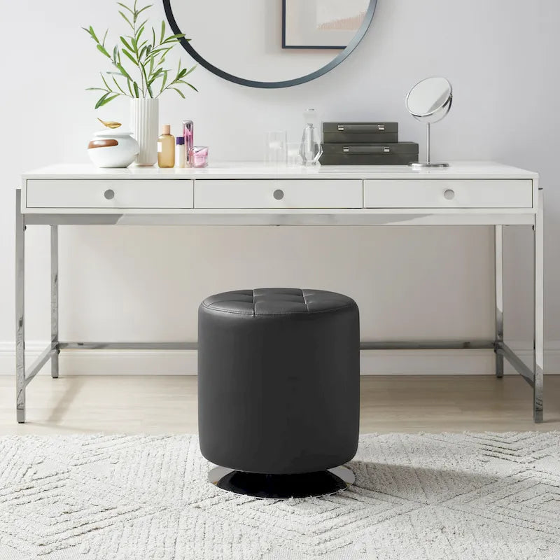 Pouf girevole in similpelle con piano rotondo trapuntato e base in acciaio