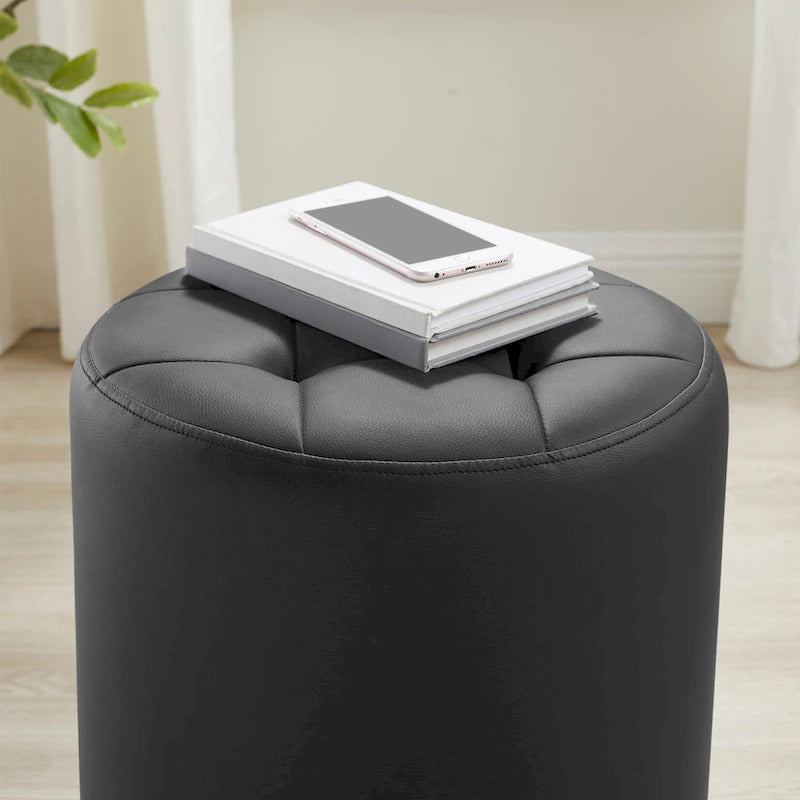 Pouf girevole in similpelle con piano rotondo trapuntato e base in acciaio
