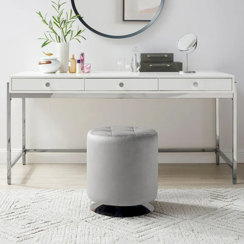 Pouf girevole in similpelle con piano rotondo trapuntato e base in acciaio