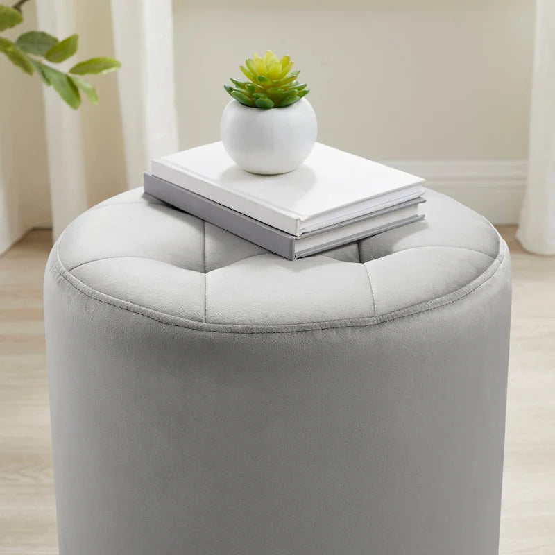 Pouf girevole in similpelle con piano rotondo trapuntato e base in acciaio