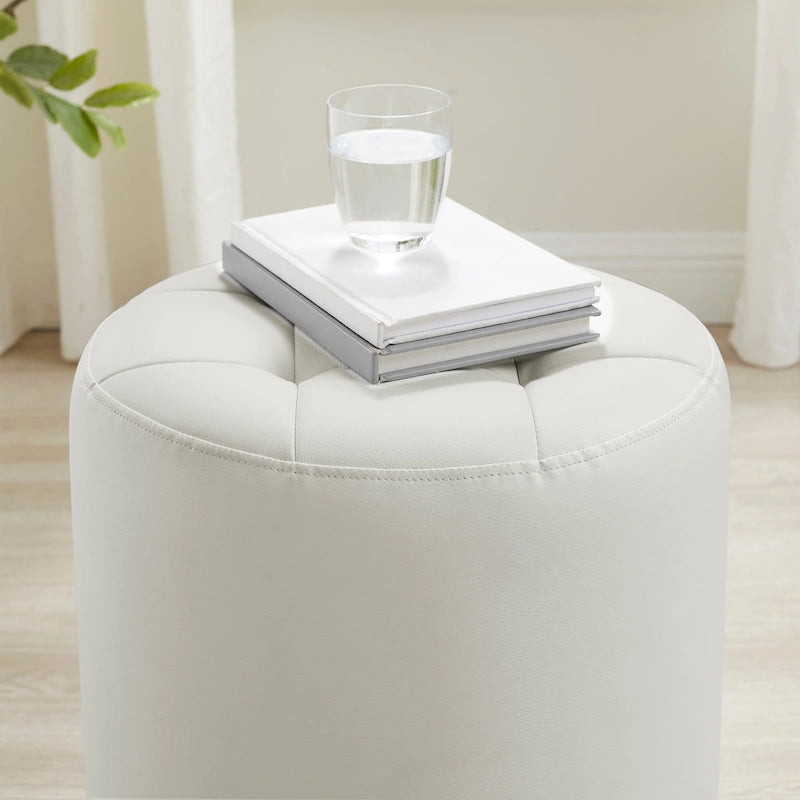 Pouf girevole in similpelle con piano rotondo trapuntato e base in acciaio