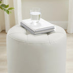 Pouf girevole in similpelle con piano rotondo trapuntato e base in acciaio